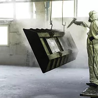 Worker Sandblasting Metal Piece